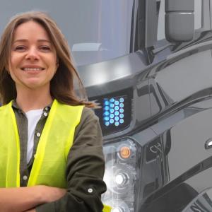 Lara in front of her truck