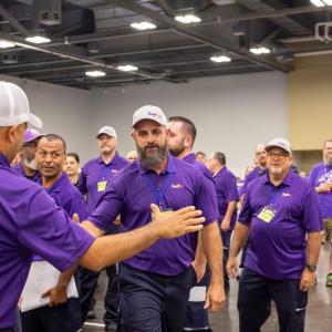 team of fedex drivers congratulating each other