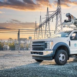a duke energy truck with powerlines behind it