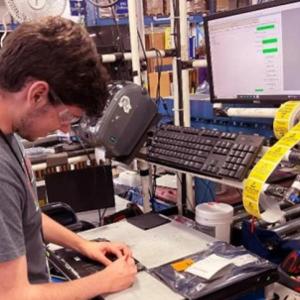Person working on computer part