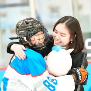 player and coach hugging