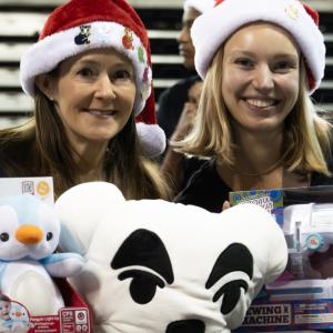 People holding up toys