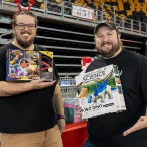 People holding up toys