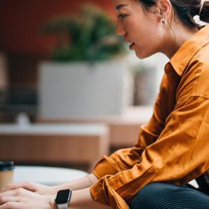 A person typing on a laptop