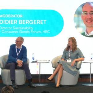 The image features a panel of speakers