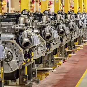 A neat row of Engines in a manufacturing setting.