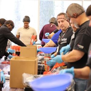 Volunteers packing food