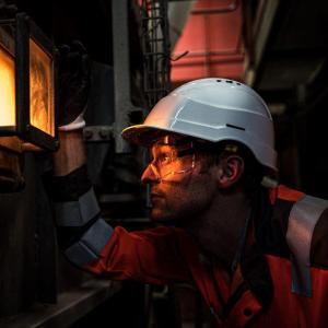 person looking into a machine