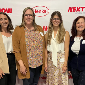 Group of women in front of Henkel logos