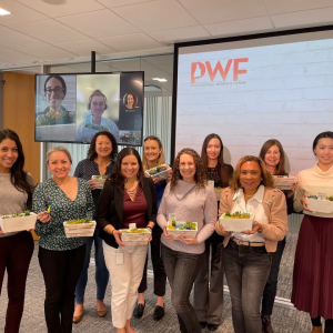 Group of women holding plants