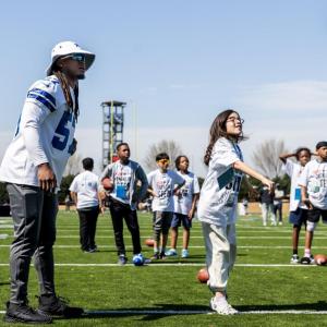 Kids playing football on Field Day