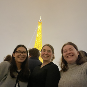 Students of Saint-Gobain EOM program in Paris with the Eiffel Tower in the background.