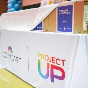 Internet Essentials laptops on a Project UP table display at Astronaut José M. Hernandez Academy.