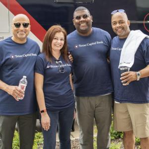 group at event all wearing Texas Capital Bank Tshirts