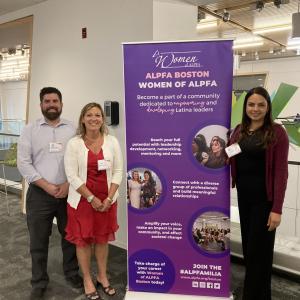 Members of Alkermes’ MOSAIC employee resource group standing next to ALPFA BOSTON poster 
