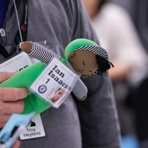 person holding a doll at event