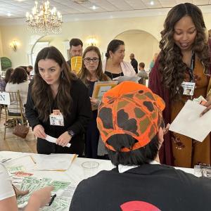 people talking at an event table