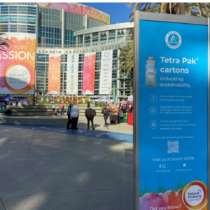 Outside a convention center. Tetra Pak cartons sign.