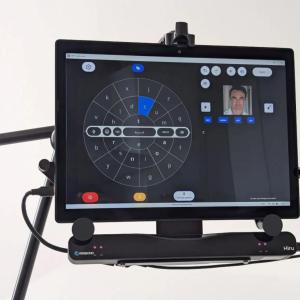 A communication device open to a circular display of letters and symbols.