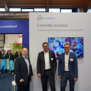 Three people stood together 