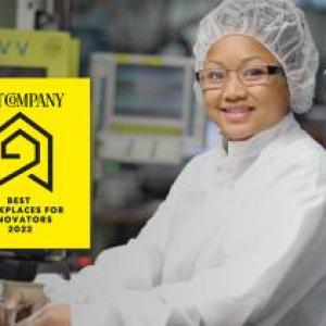 a person seated in lab protective gear, monitors and equipment behind them. "Fast Company" award logo and Boston Scientific logo in upper right corner