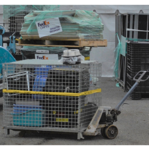 person pulling a transport cage of rescued animals