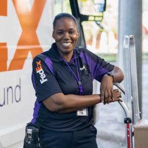 smiling FedEx employee