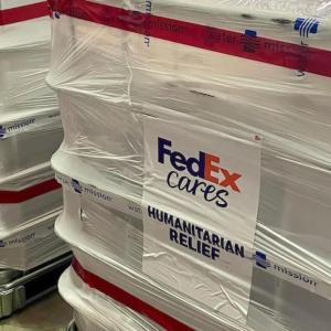 Wrapped pallets with FedEx Cares label.