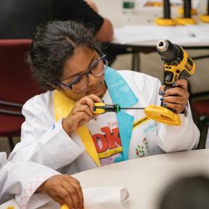 Woman using DeWalt drill