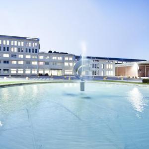 building with water feature in front