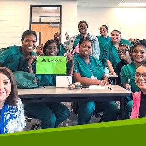 A group smiling in a classroom