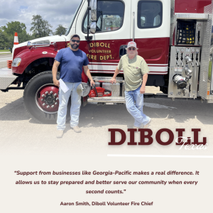 Group from the Diboll fire department standing by fire truck