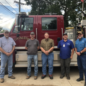 4 Livingston firefighters in front of truck