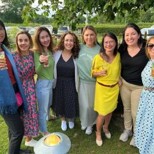 A team of people posed outside