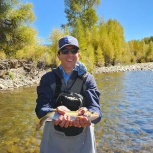 a person holding a fish