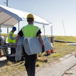 Worker carrying equipment 
