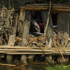 Nya Jol living precariously close to the flood line. It has been five years since the floods wrecked havoc on her community. "My husband goes to market often to find work, while I remain here to look after the children. I hope he finds some casual work soon so we can buy vegetables to eat with the fish we catch" says Nya.