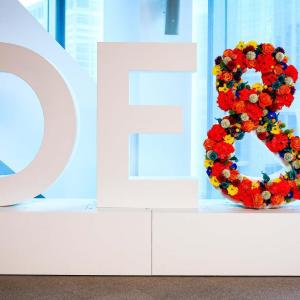 DE&I statue, the "&" is covered in flowers