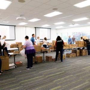 Volunteers packing food