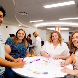 volunteers writing notes