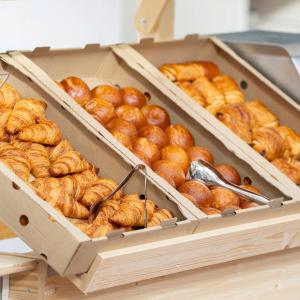 Boxes of different breads and serving utensils.