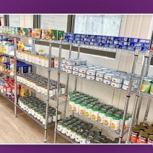 Shelves of stocked pantry food items.