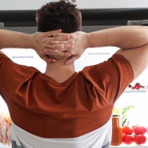 Person in front of open fridge