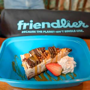 three friendlier containers with food in them, a 'friendlier' bag behind them