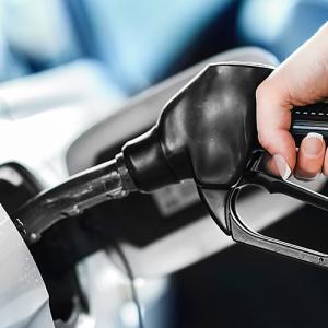 a person pumping fuel into their vehicle