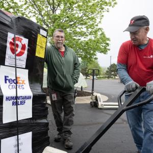 person moving relief materials