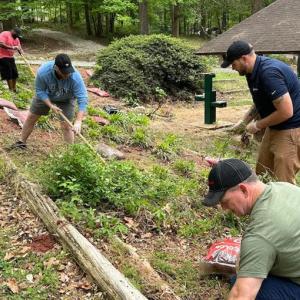 A group of volunteers doing landscaping.