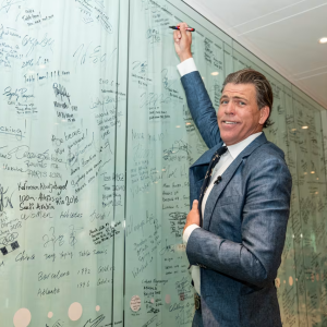 Gary Hall Jr. writing on a dry erase board