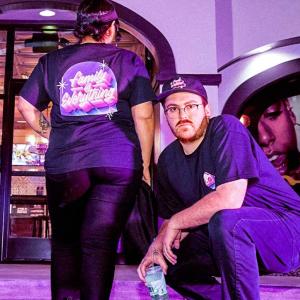 2 people posing in exclusive team gear