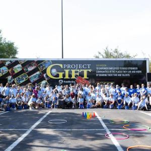 All participants looking at the camera with GIFT banner  behind them